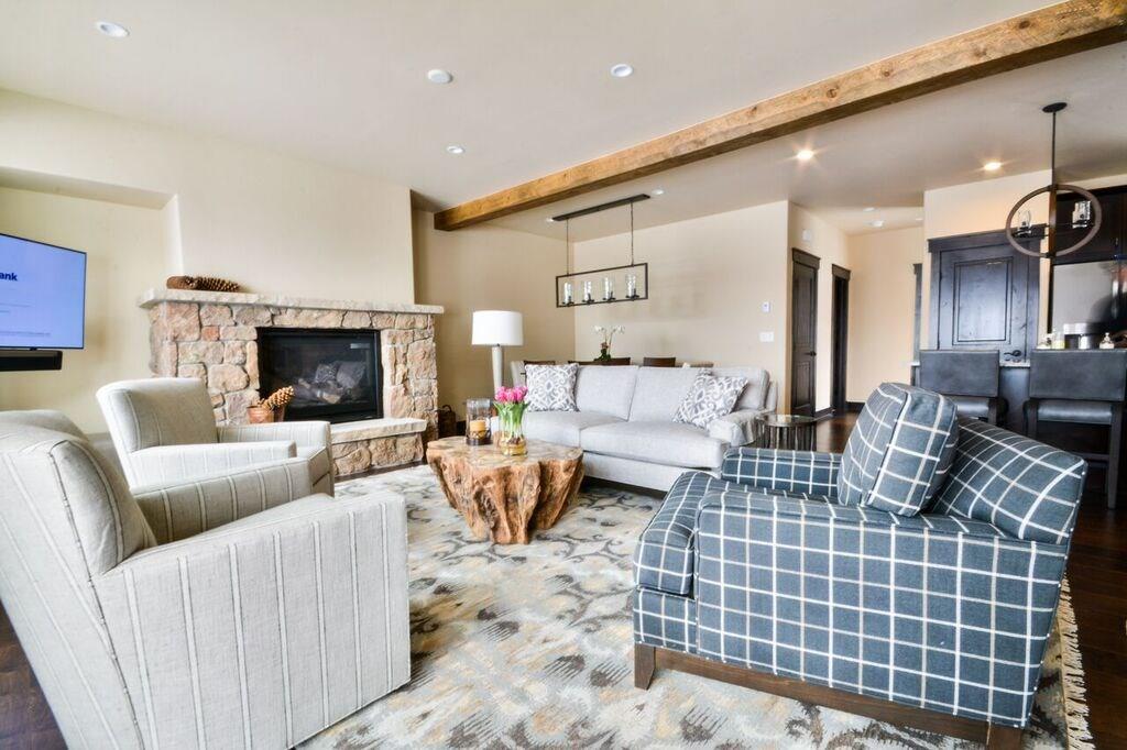 742 Independence Road, Unit 3B Keystone, CO 80435 - Photo 2 of 25 a living room with furniture a fireplace and a flat screen tv