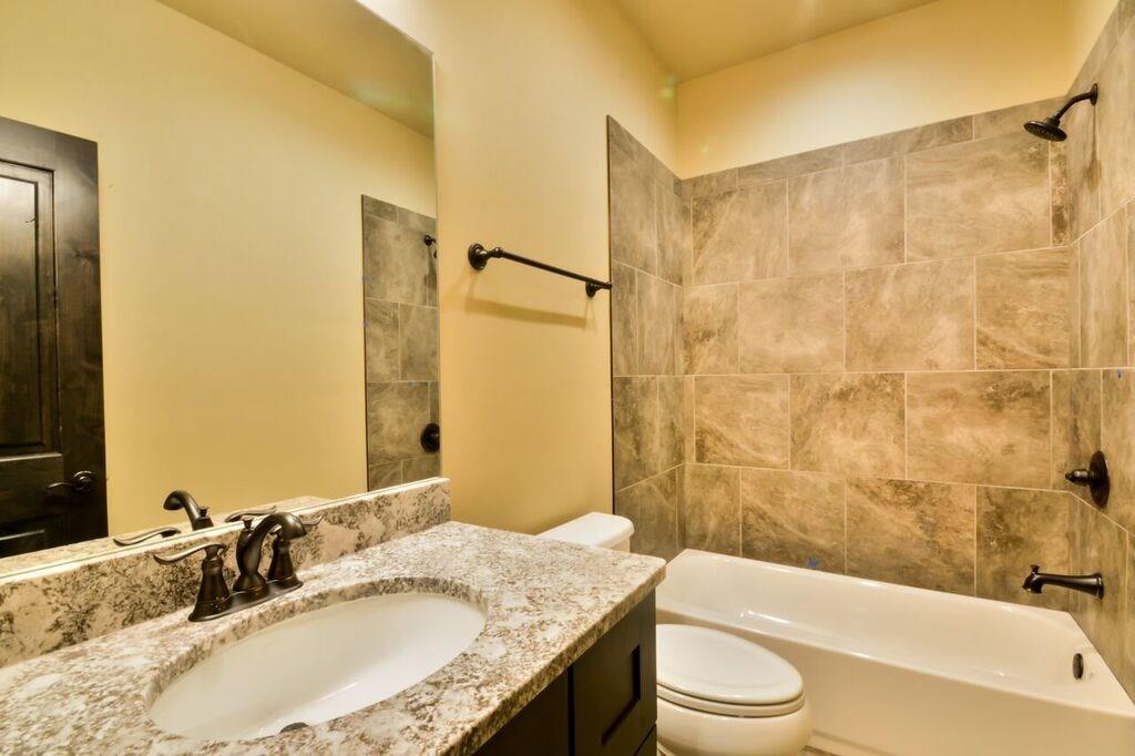 742 Independence Road, Unit 3B Keystone, CO 80435 - Photo 14 of 25 a bathroom with a granite countertop sink toilet and shower