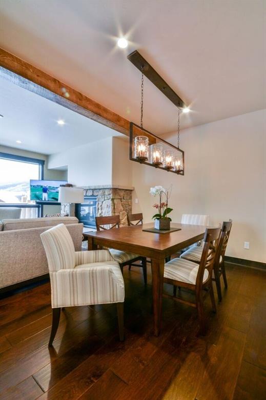 742 Independence Road, Unit 3B Keystone, CO 80435 - Photo 5 of 25 a dining room with stainless steel appliances kitchen island a table and chairs
