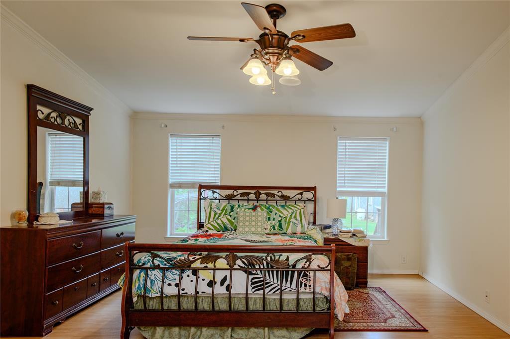 1468 Cedar Mills Road Gordonville, TX 76245 - Photo 16 of 35 a bed sitting in a bedroom next to a window