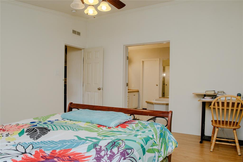 1468 Cedar Mills Road Gordonville, TX 76245 - Photo 17 of 35 a bedroom with a bed and a chair