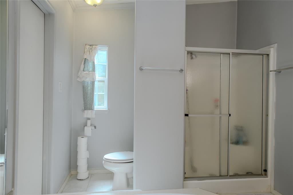 1468 Cedar Mills Road Gordonville, TX 76245 - Photo 20 of 35 a bathroom with a toilet and a shower