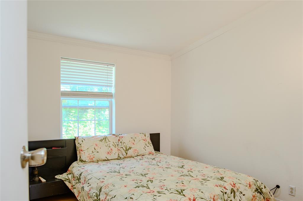 1468 Cedar Mills Road Gordonville, TX 76245 - Photo 22 of 35 a bedroom with a bed and a window