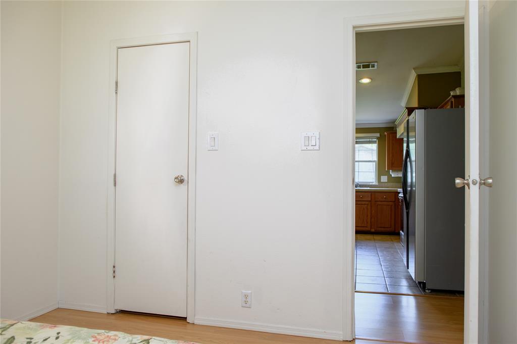 1468 Cedar Mills Road Gordonville, TX 76245 - Photo 23 of 35 a view of a bedroom from a hallway