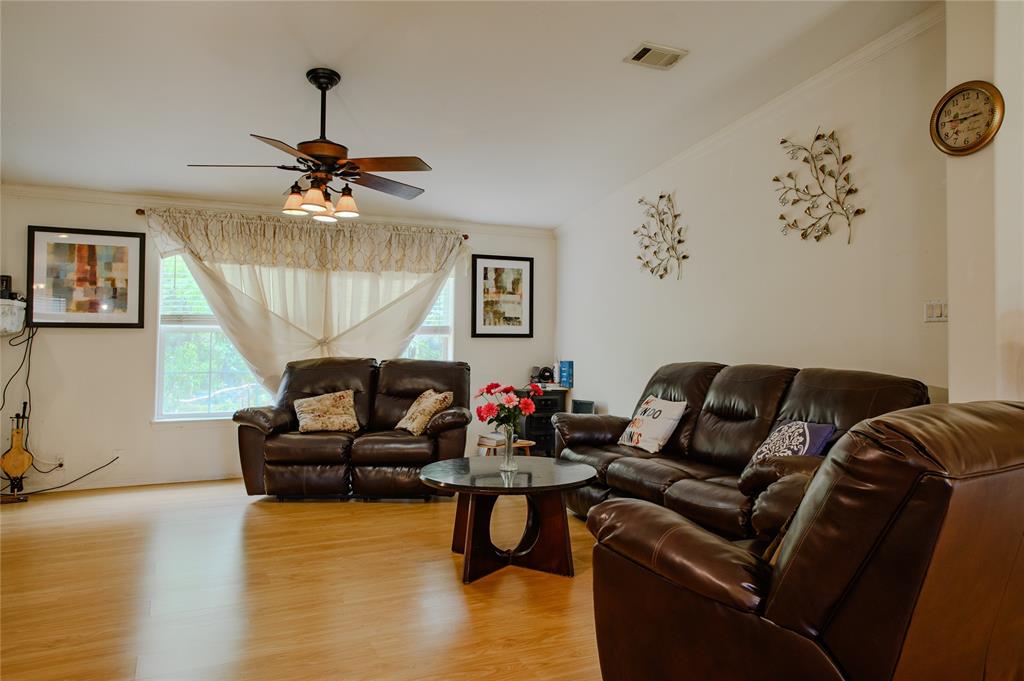 1468 Cedar Mills Road Gordonville, TX 76245 - Photo 8 of 35 a living room with furniture and a chandelier