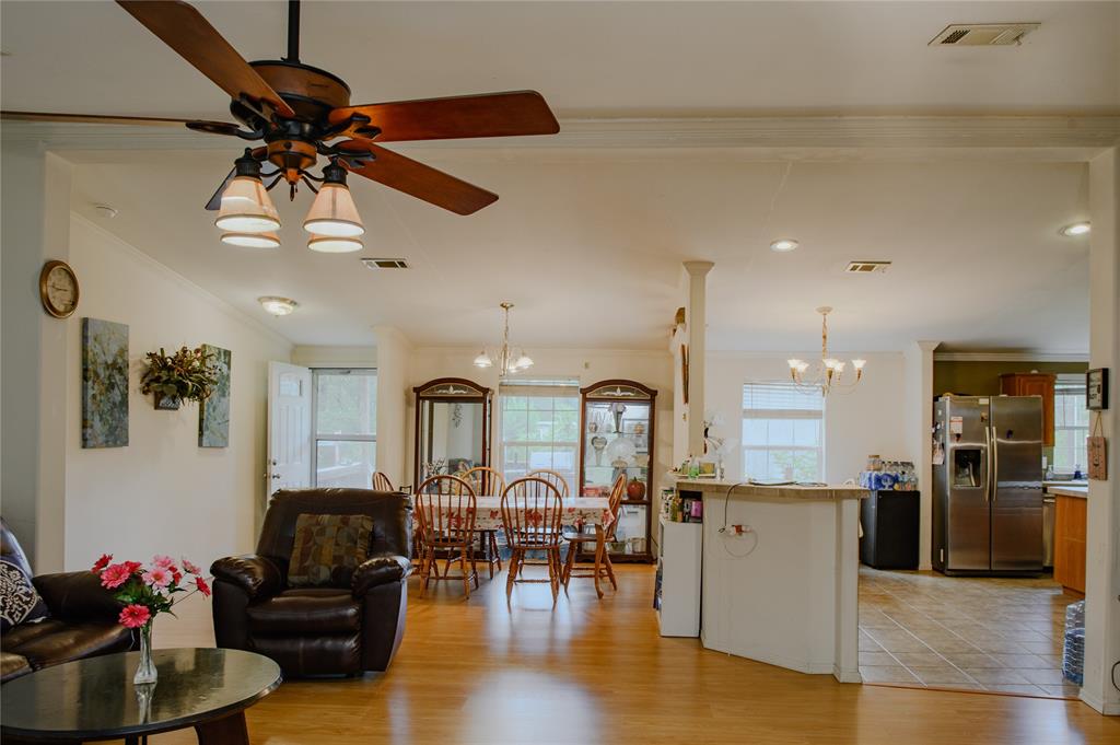 1468 Cedar Mills Road Gordonville, TX 76245 - Photo 9 of 35 a living room with lots of furniture and kitchen view
