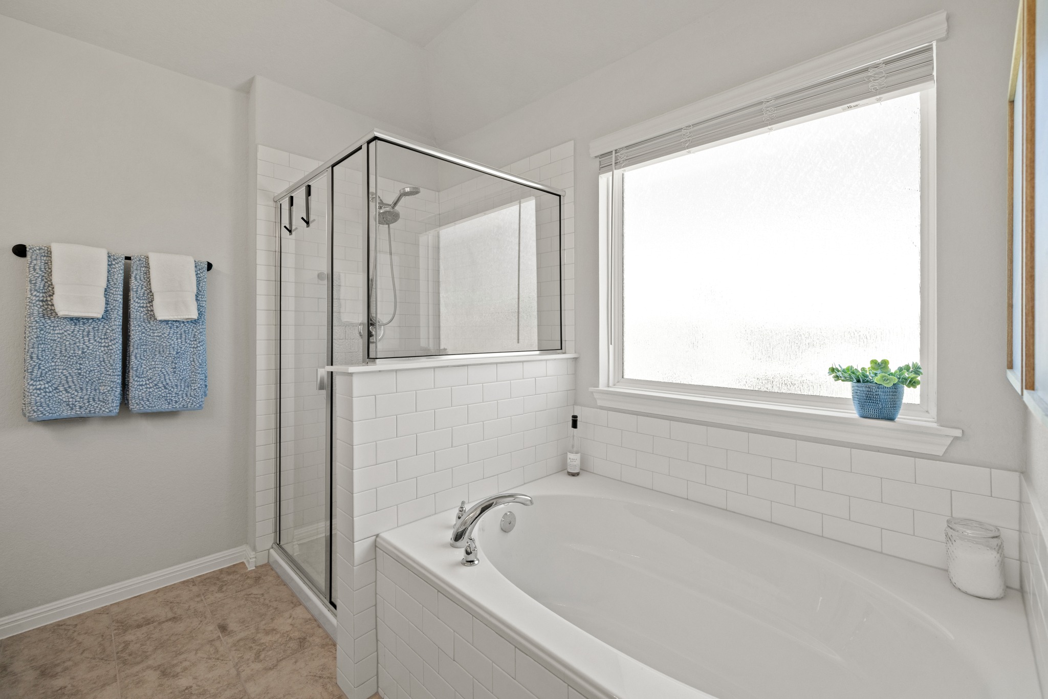2049 Winston Way Leander, TX 78641 - Photo 15 of 35 Separate shower, large opaque window and luxurious soaking tub.