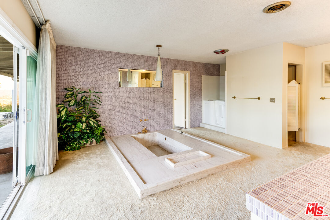 1950 Carla Ridge Beverly Hills, CA 90210 - Photo 15 of 29 a living room with yard