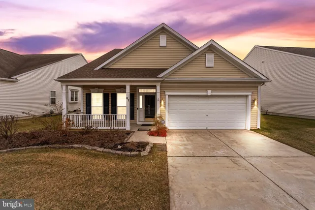 a front view of a house with yard