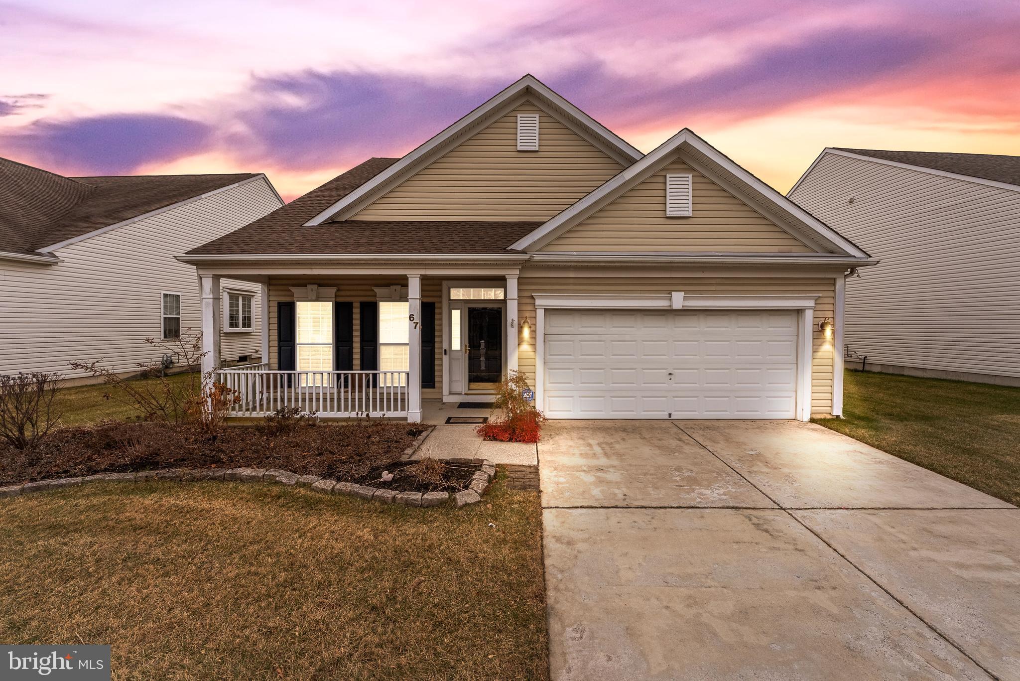 a front view of a house with yard