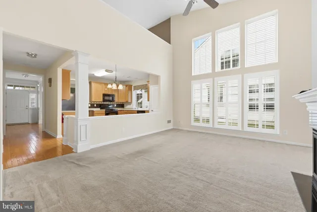 a view of a kitchen with furniture and floor to ceiling window