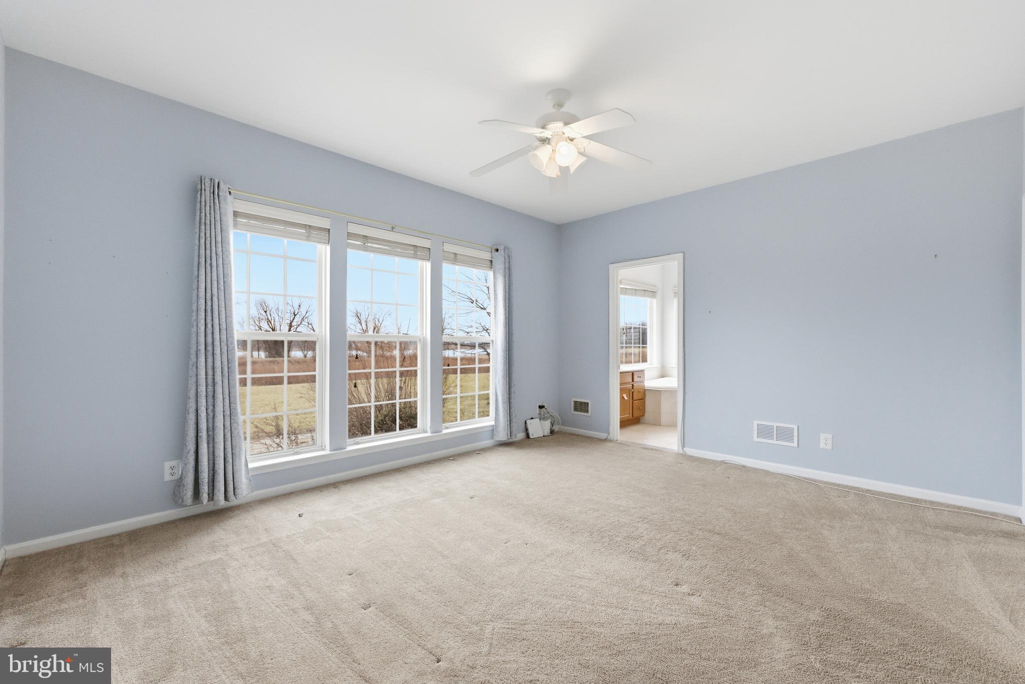 67 Pennington Court Delanco, NJ 08075 - Photo 18 of 35 a view of an empty room with chandelier fan and windows