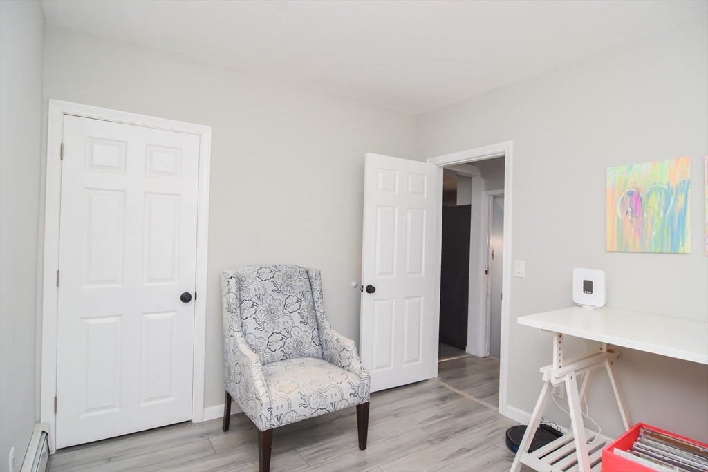 79 Turner Street Attleboro, MA 02703 - Photo 26 of 42 a living room with furniture and a wooden floor