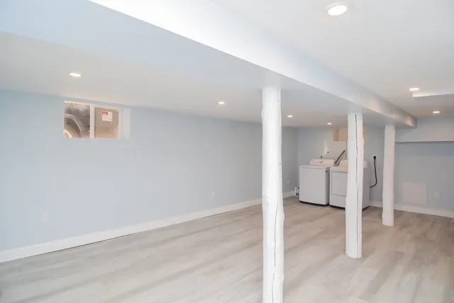 a view of a big room with wooden floor and a ceiling fan