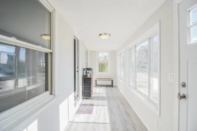 a bathroom with a glass shower door and a bathtub
