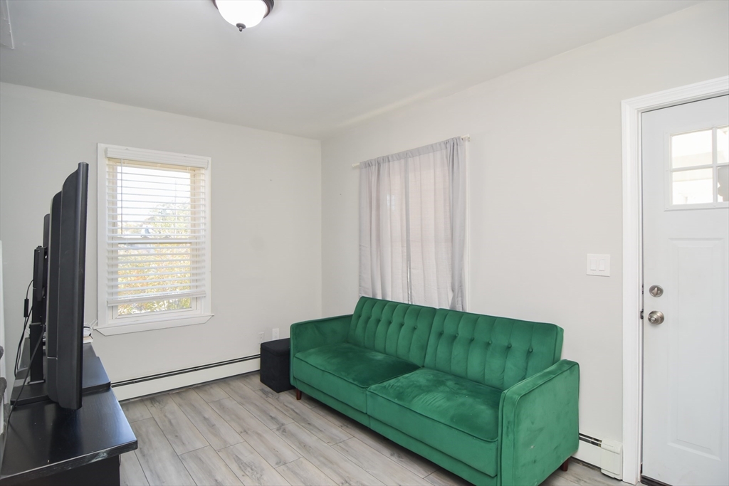79 Turner Street Attleboro, MA 02703 - Photo 9 of 42 a living room with furniture and a window