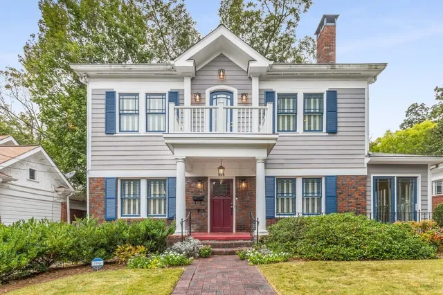 a front view of a house with garden