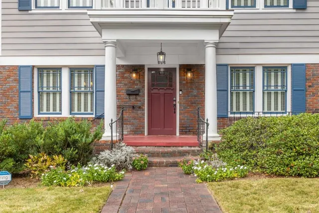 front view of a house with a small yard