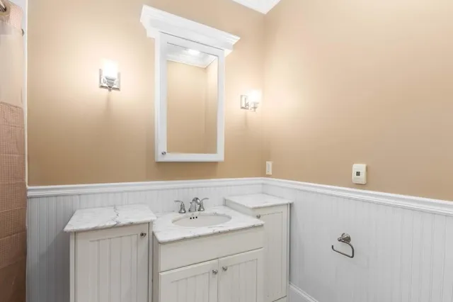 an empty room with a window and a ceiling fan