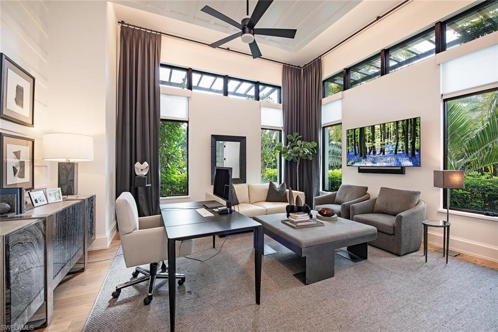 1300 Nautilus Road Naples, FL 34102 - Photo 15 of 21 a living room with furniture and a large window