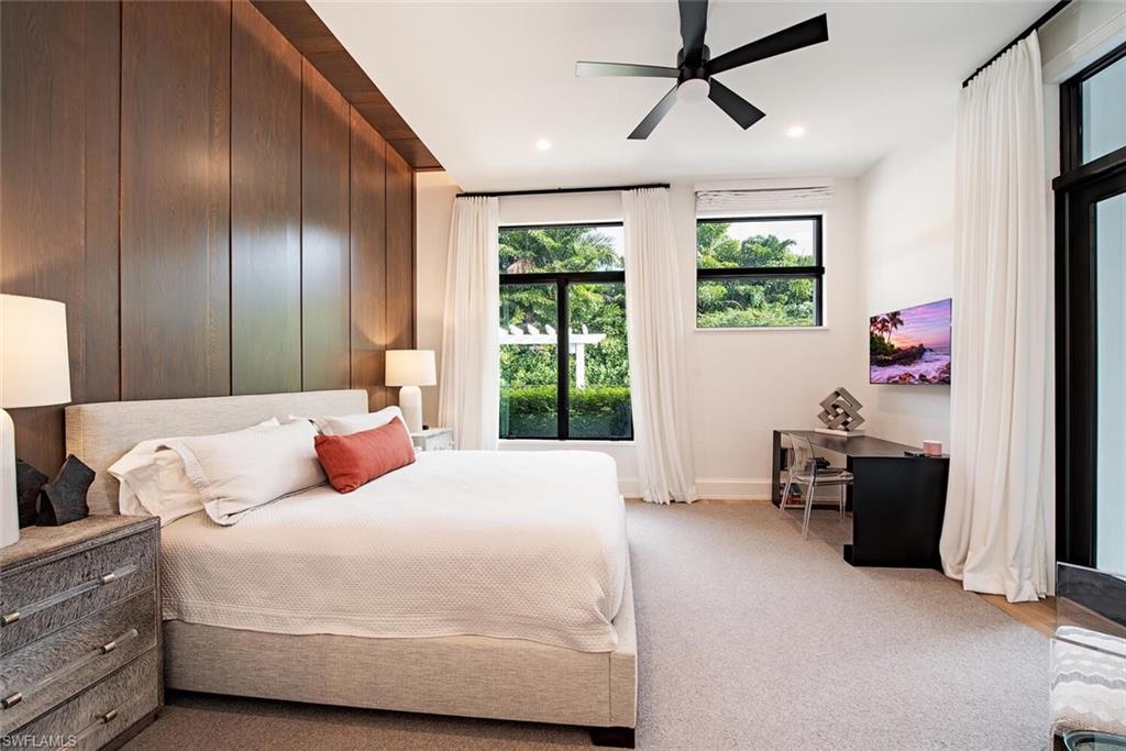 1300 Nautilus Road Naples, FL 34102 - Photo 16 of 21 a bedroom with a bed dresser and a window