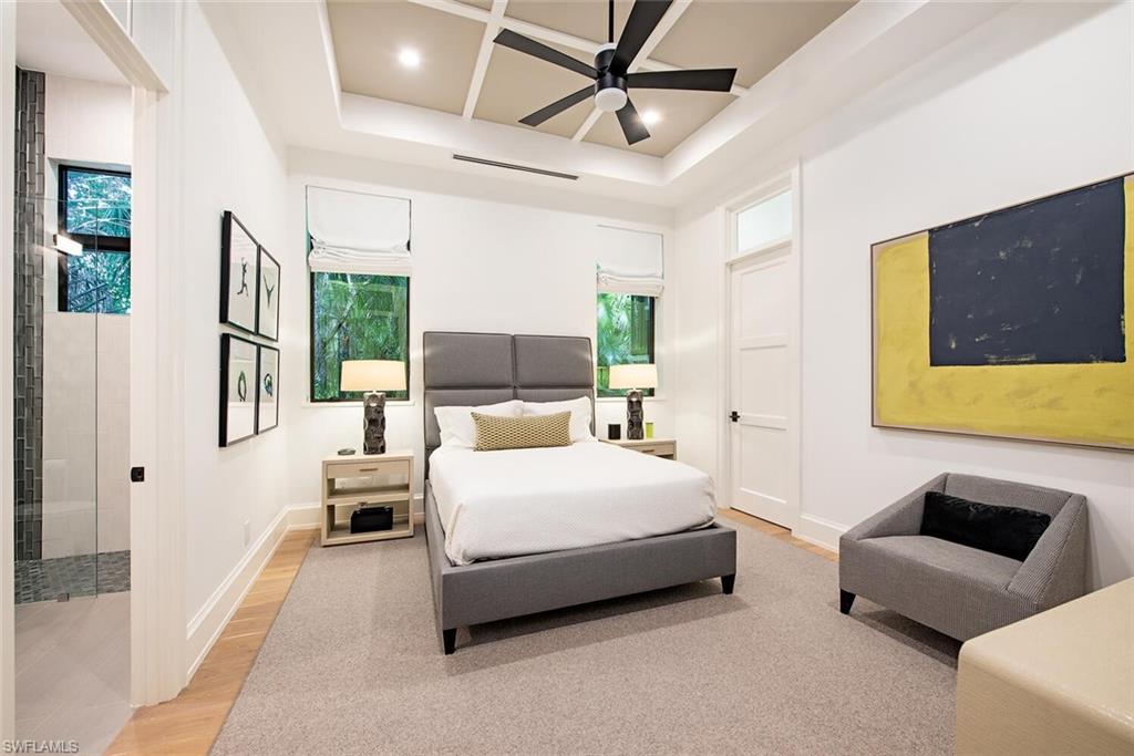 1300 Nautilus Road Naples, FL 34102 - Photo 17 of 21 a bedroom with a bed couch and window