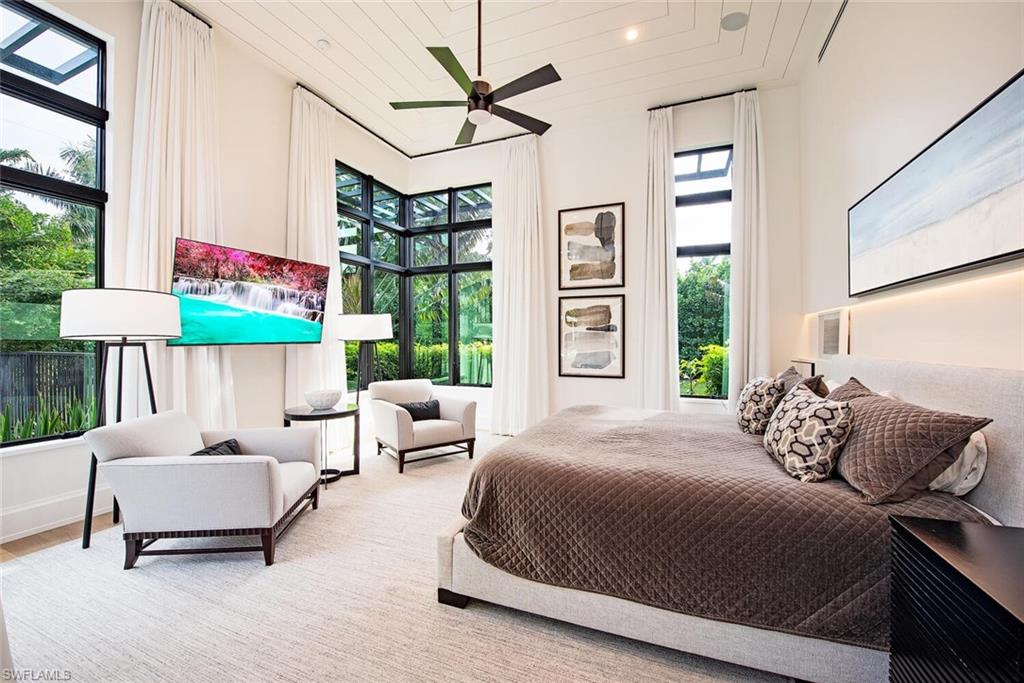 1300 Nautilus Road Naples, FL 34102 - Photo 19 of 21 a bedroom with a bed and a couch