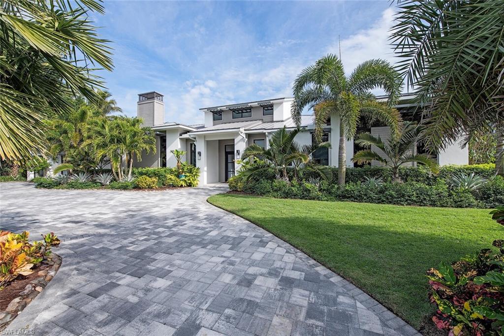 1300 Nautilus Road Naples, FL 34102 - Photo 3 of 21 a front view of house with yard and green space
