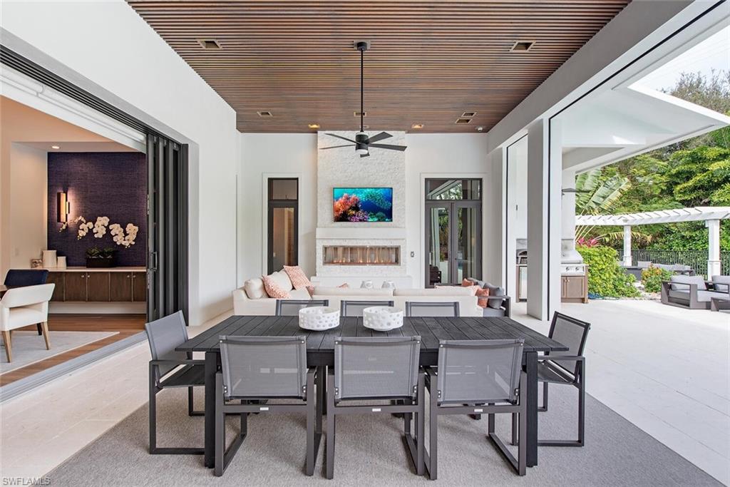 1300 Nautilus Road Naples, FL 34102 - Photo 6 of 21 a view of a dining room with furniture window and outside view