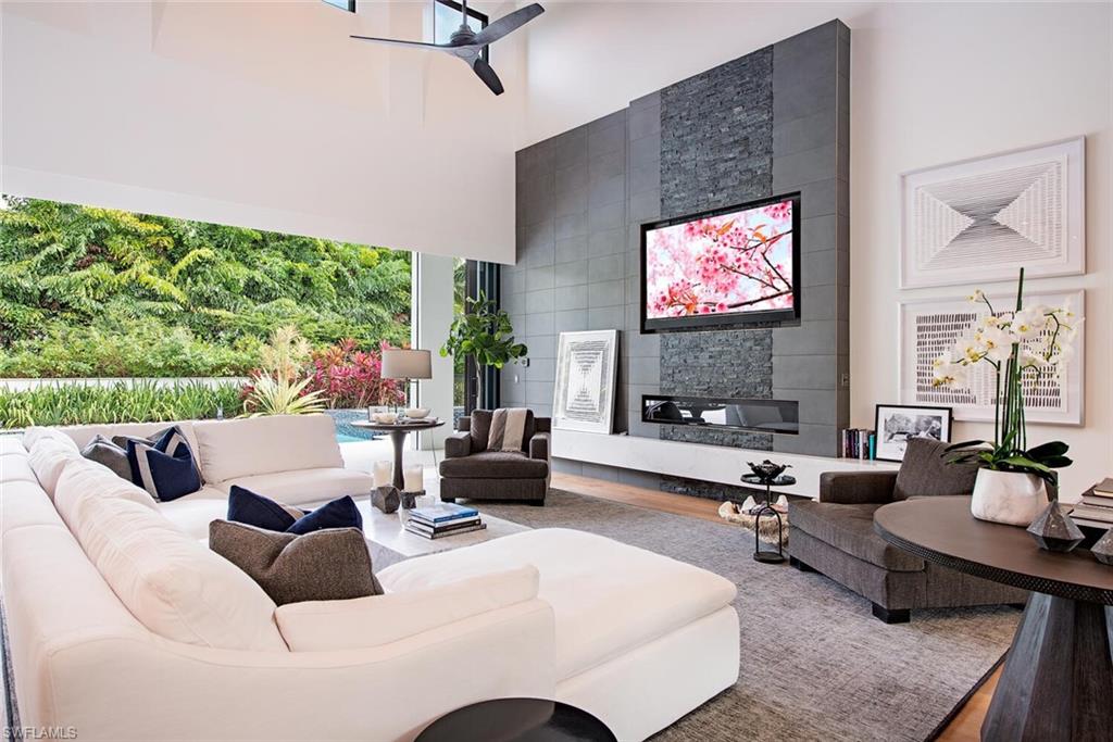 1300 Nautilus Road Naples, FL 34102 - Photo 8 of 21 a living room with furniture and a flat screen tv