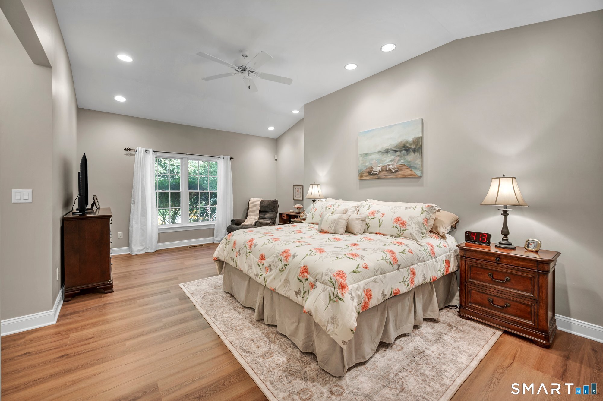 270 Copper Ridge Southington, CT 06489 - Photo 21 of 40 Primary bedroom suite featuring new luxury vinyl plank flooring throughout, vaulted ceilings, and separate walk-in closets.