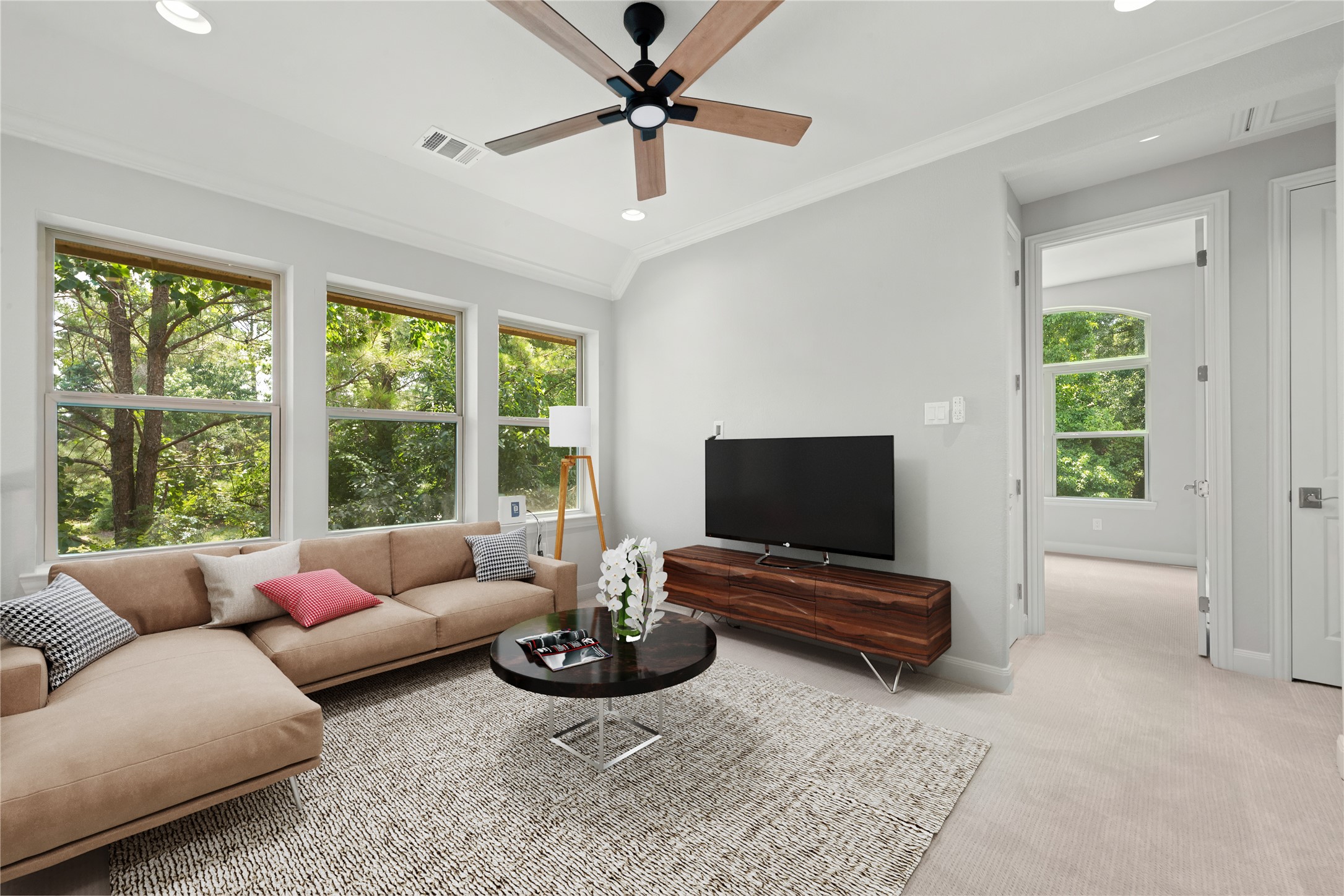 98 Herons Flight Place Spring, TX 77389 - Photo 13 of 29 Spacious upstairs game room with vaulted ceiling, wall of windows overlooking mature trees, and plenty of room to relax or entertain. *Virtually Staged