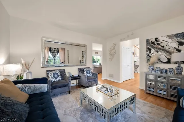 a living room with furniture and a table