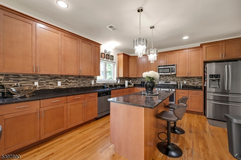 6 Jacob Way Phillipsburg, NJ 08865 - Photo 16 of 34 a kitchen with stainless steel appliances granite countertop a sink refrigerator and cabinets