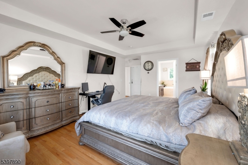 6 Jacob Way Phillipsburg, NJ 08865 - Photo 21 of 34 a bedroom with a large bed and a flat screen tv