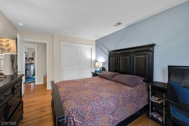 6 Jacob Way Phillipsburg, NJ 08865 - Photo 28 of 34 a bedroom with a bed and a mirror on dresser