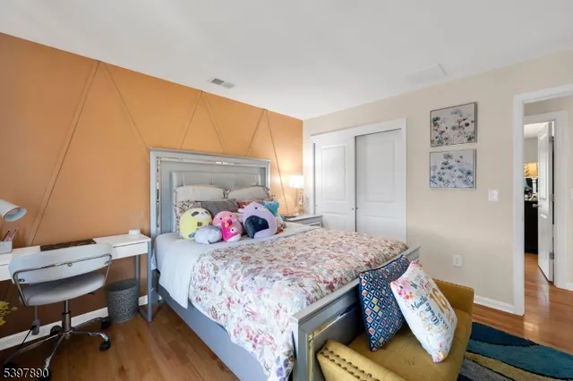 a bedroom with a bed and a table in it