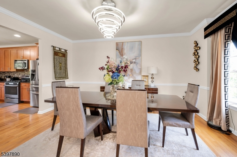 6 Jacob Way Phillipsburg, NJ 08865 - Photo 8 of 34 a dining room with furniture a chandelier and wooden floor