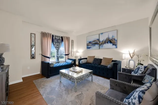 a living room with furniture and a table