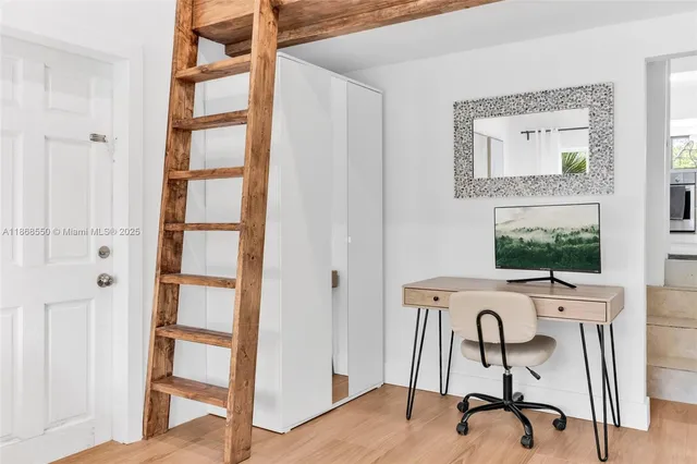 a view of a livingroom with furniture and front door
