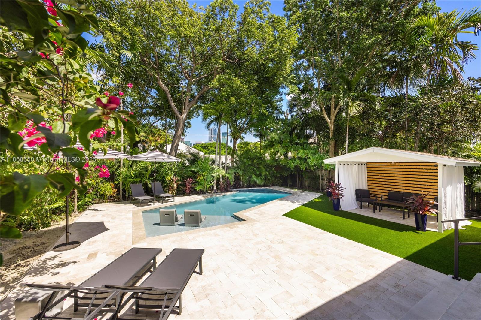 141 Southwest 23rd Road Miami, FL 33129 - Photo 2 of 32 a view of backyard with a garden and entertaining space