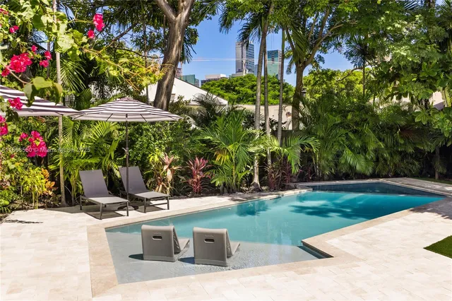 a view of a backyard with plants