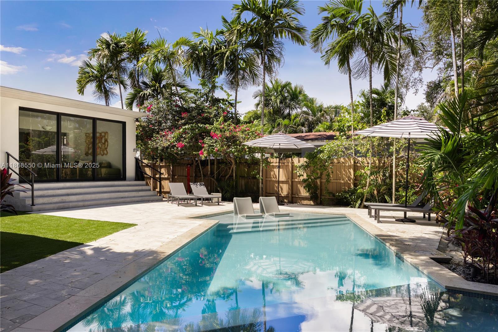 141 Southwest 23rd Road Miami, FL 33129 - Photo 28 of 32 a view of a house with swimming pool and sitting area