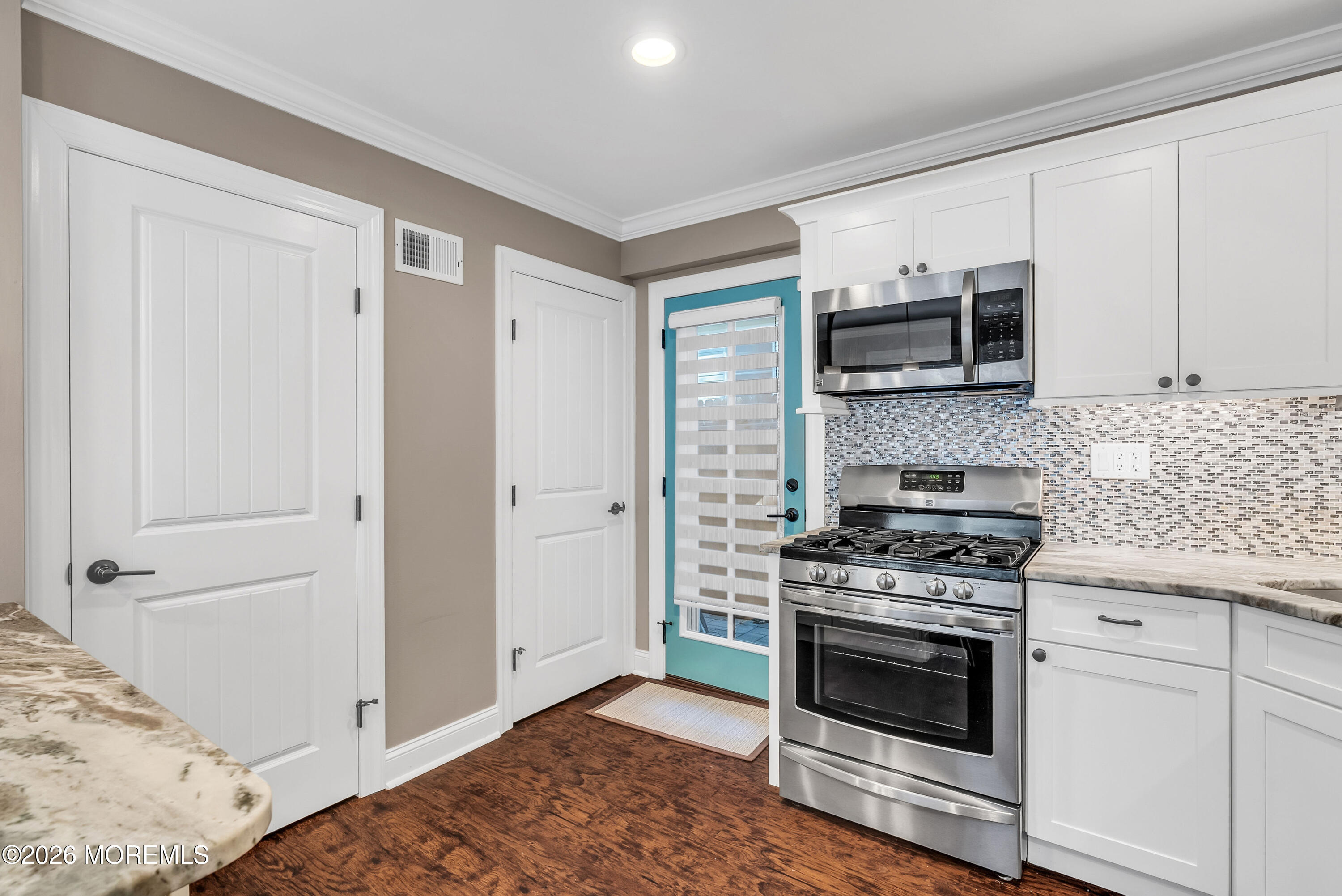 187 Pinecrest Road Oakhurst, NJ 07755 - Photo 13 of 26 a kitchen with a stove and a microwave