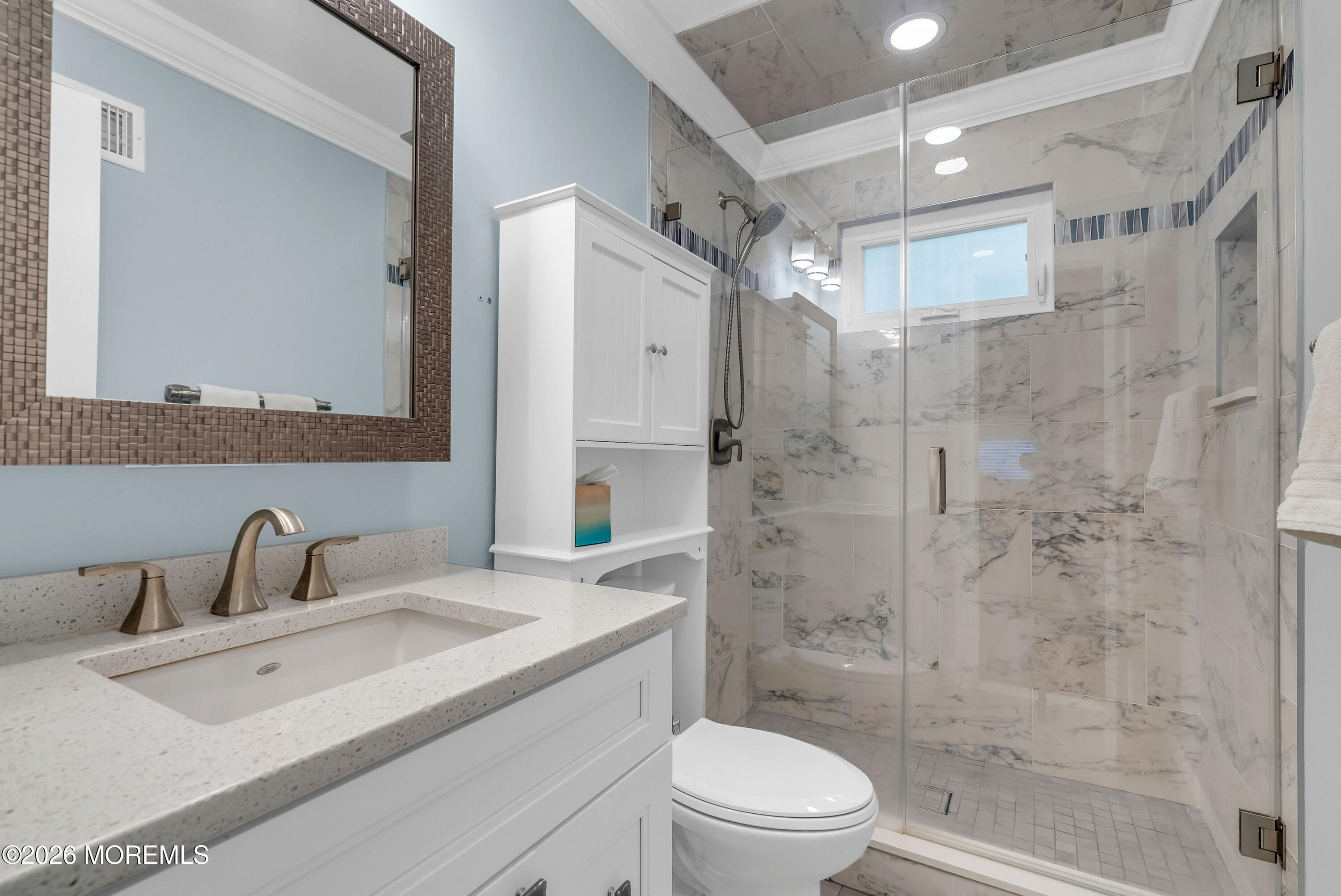 187 Pinecrest Road Oakhurst, NJ 07755 - Photo 17 of 26 a bathroom with a sink toilet a mirror and shower