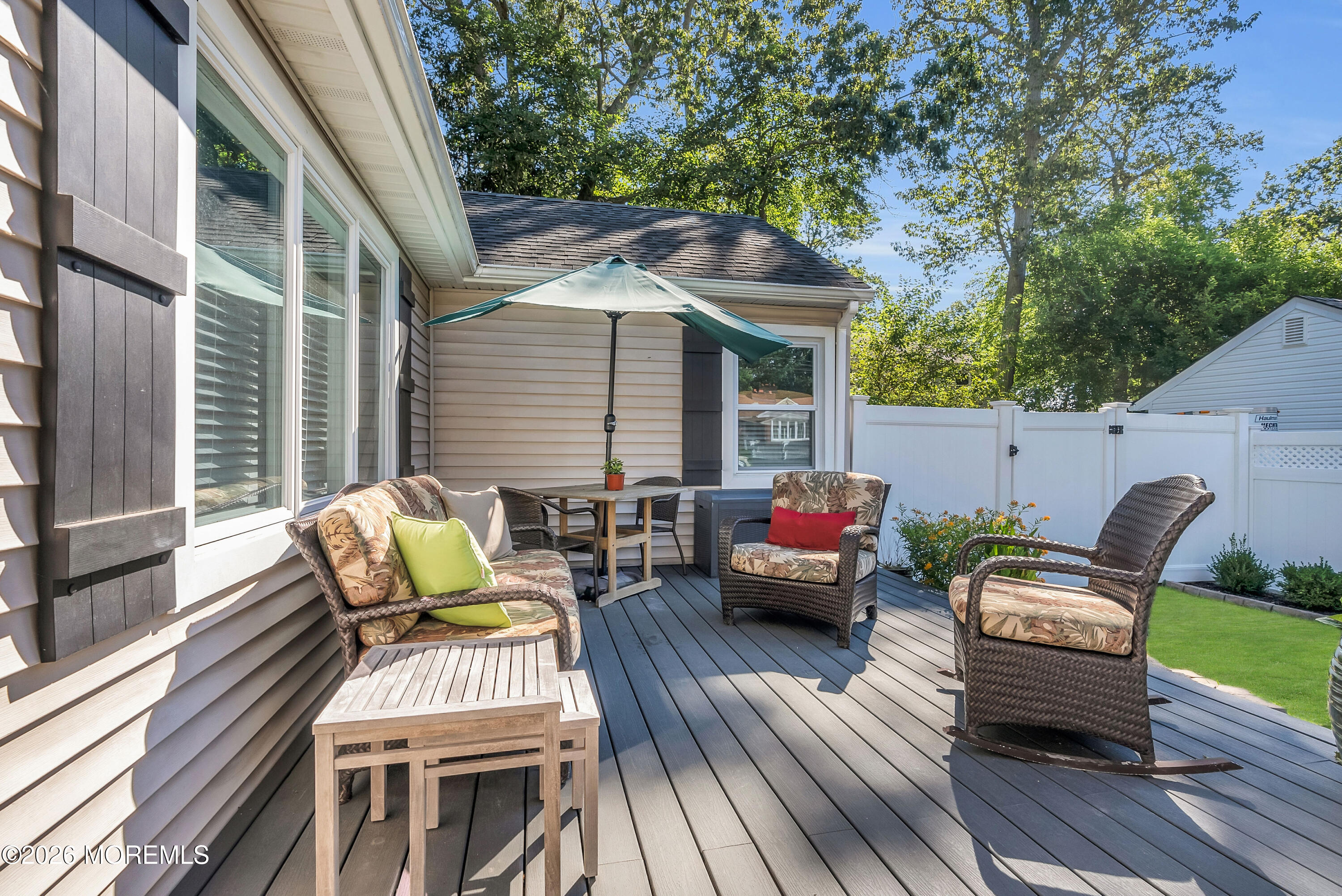 187 Pinecrest Road Oakhurst, NJ 07755 - Photo 5 of 26 a view of a patio with couple of chairs and a couch