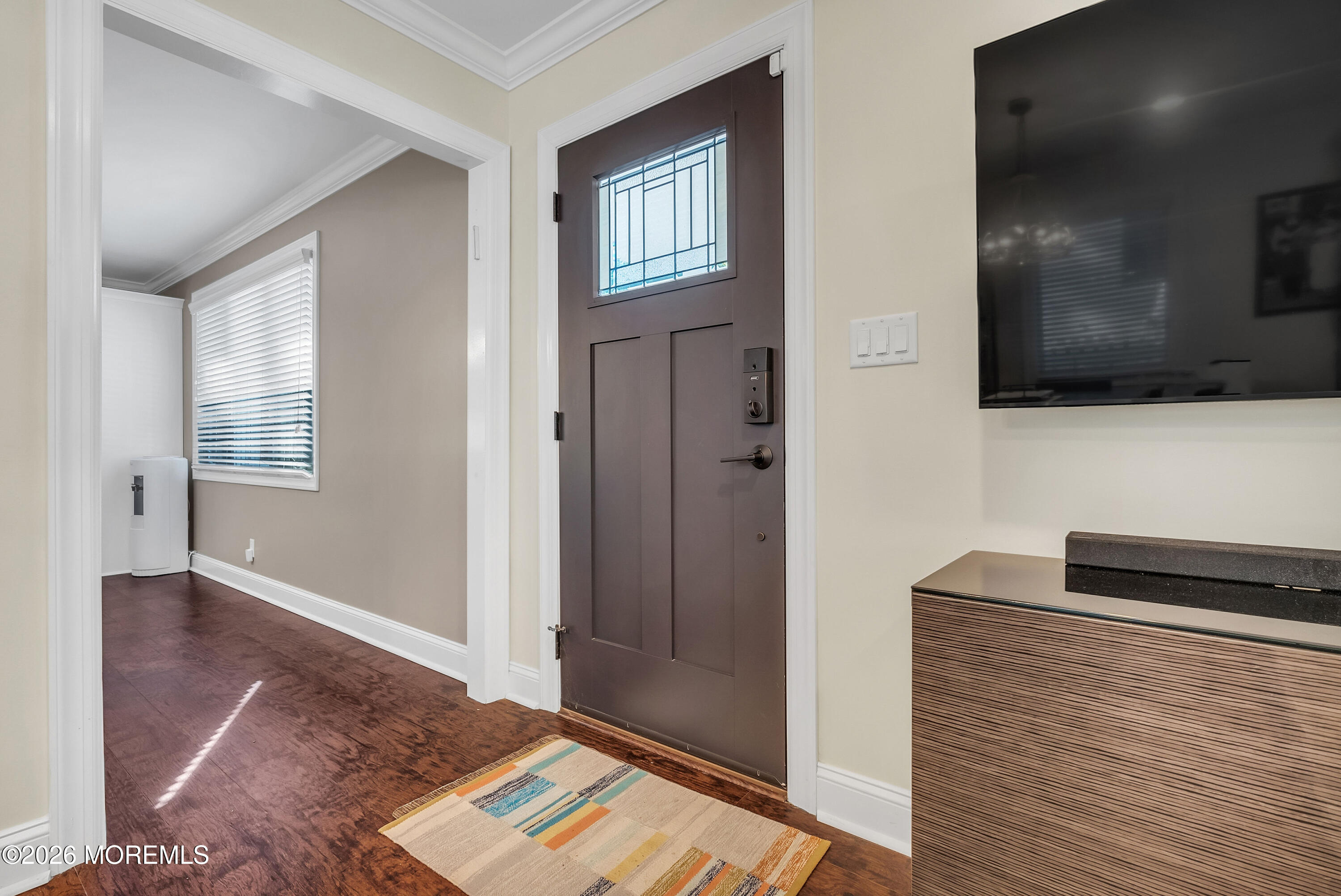 187 Pinecrest Road Oakhurst, NJ 07755 - Photo 6 of 26 a view of a livingroom with wooden floor and a flat screen tv