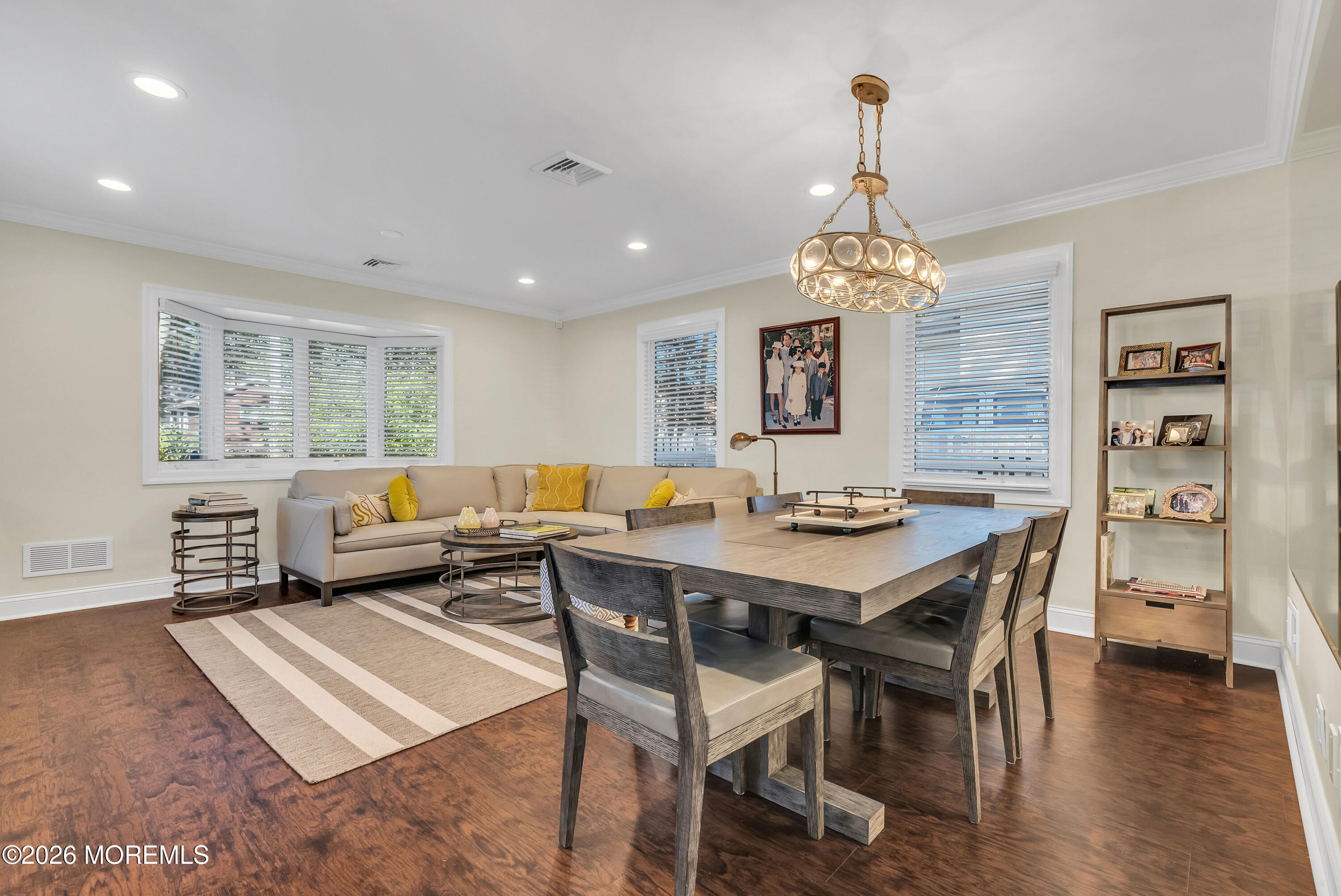 187 Pinecrest Road Oakhurst, NJ 07755 - Photo 7 of 26 a living room with a table chairs and a dining table
