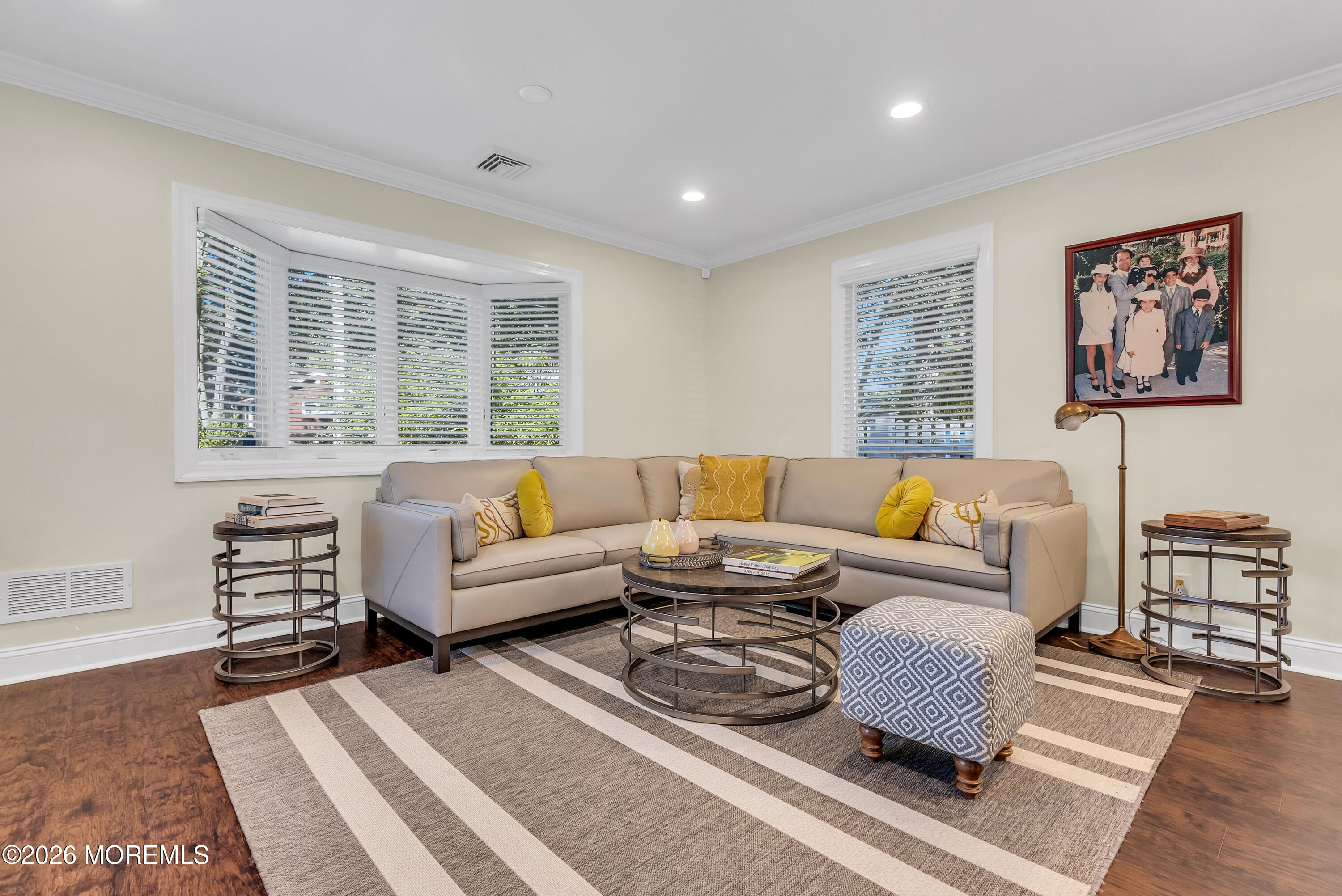 187 Pinecrest Road Oakhurst, NJ 07755 - Photo 8 of 26 a living room with furniture a rug and a large window