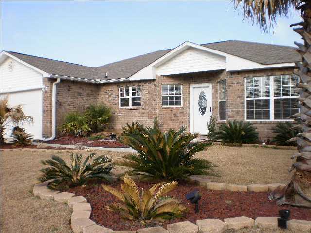 267 Limestone Circle Crestview, FL 32539 - Photo 1 of 9 a front view of a house with a yard